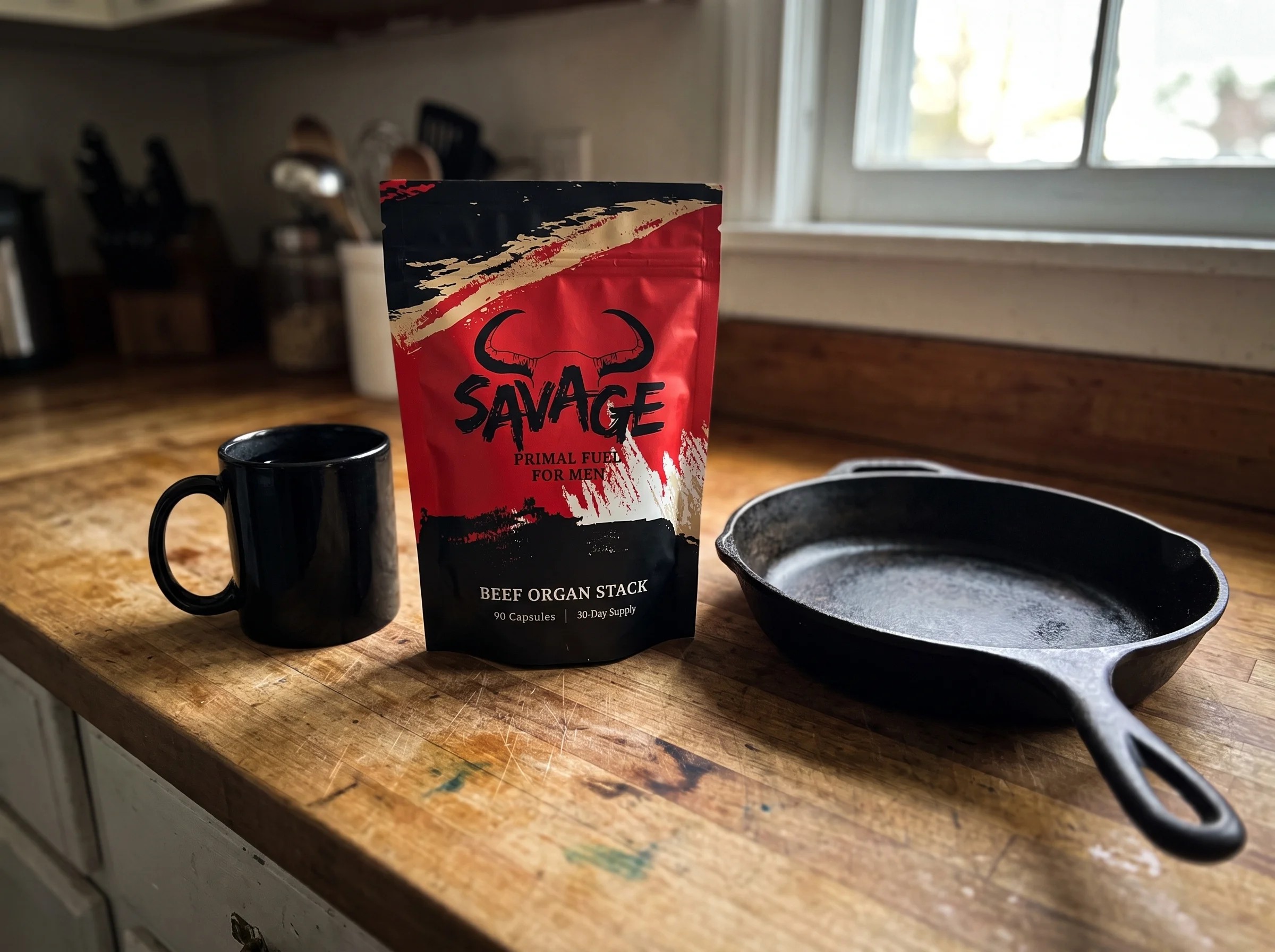 The Savage Beef Organ Stack pouch, a red and black stand-up pouch with a bull-horn logo and the words BEEF ORGAN STACK, sitti