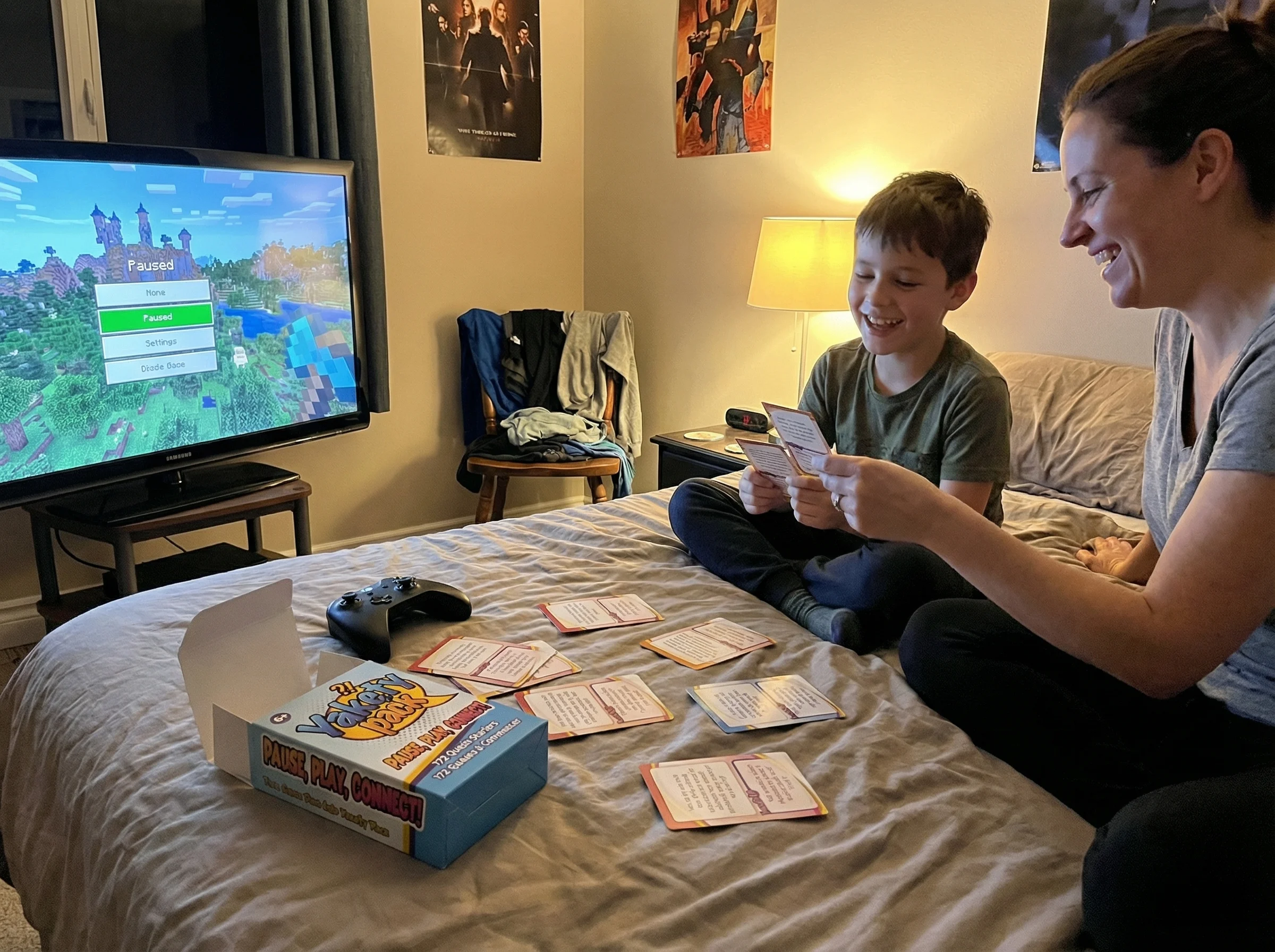 A boy's room at night, soft light from a paused game screen, controller set aside on the bed, suggesting a break after a toug
