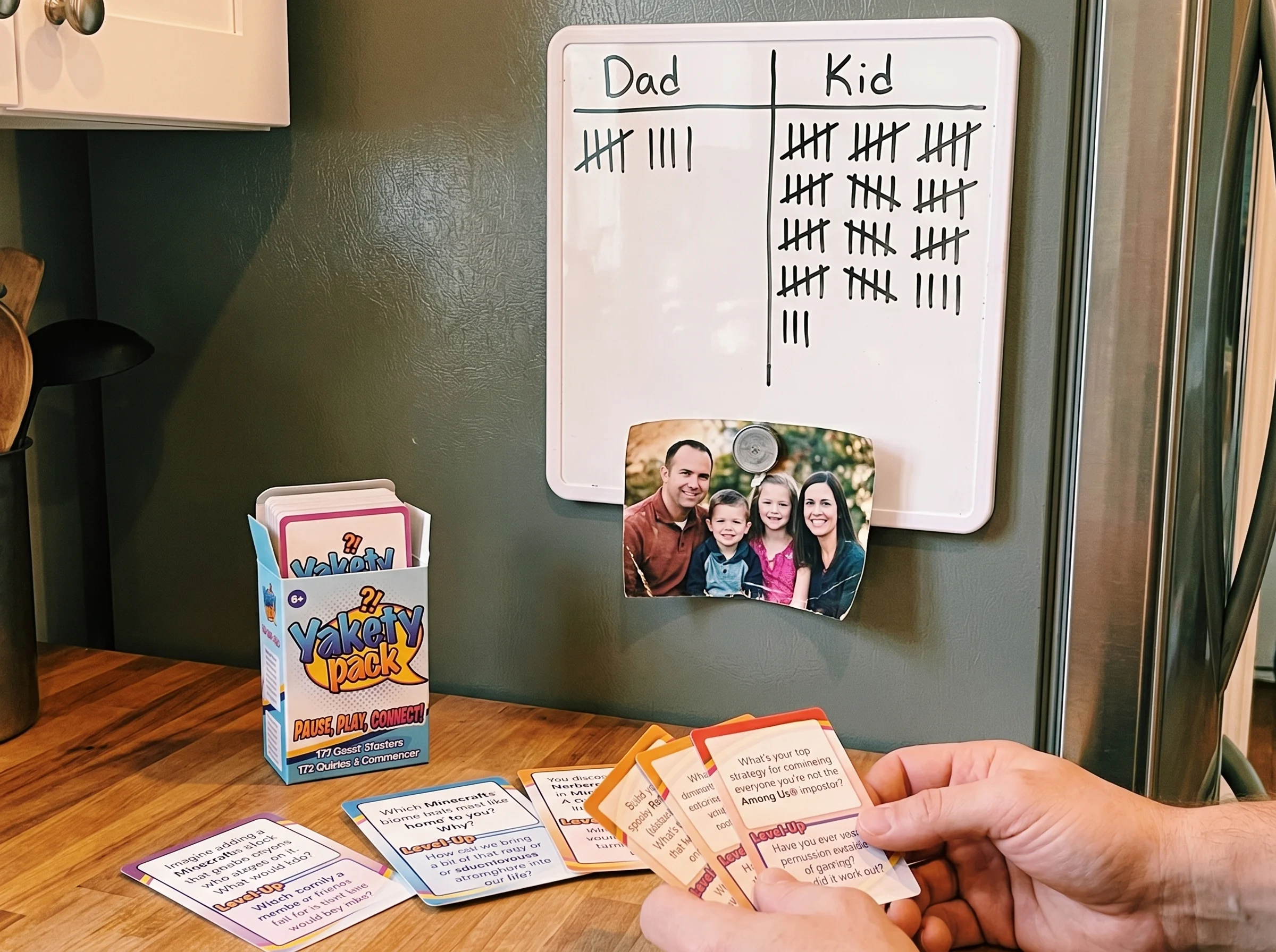 A whiteboard on a fridge covered in tally marks with "Dad" and "Kid" written at the top, kid's score way ahead, a magnet hold