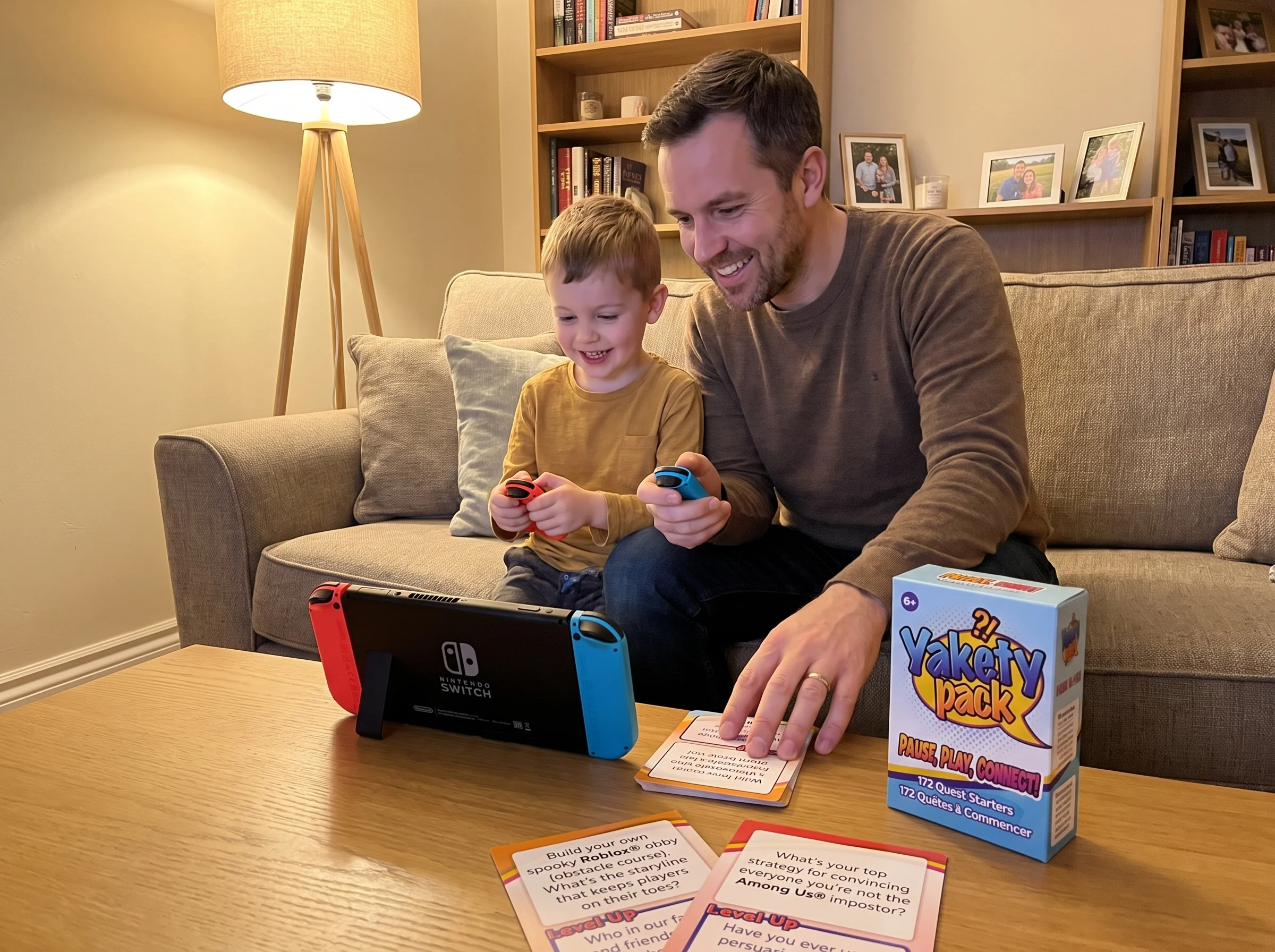 A father and young son sitting shoulder to shoulder on the couch playing a Nintendo Switch together, the dad holding one Joy-