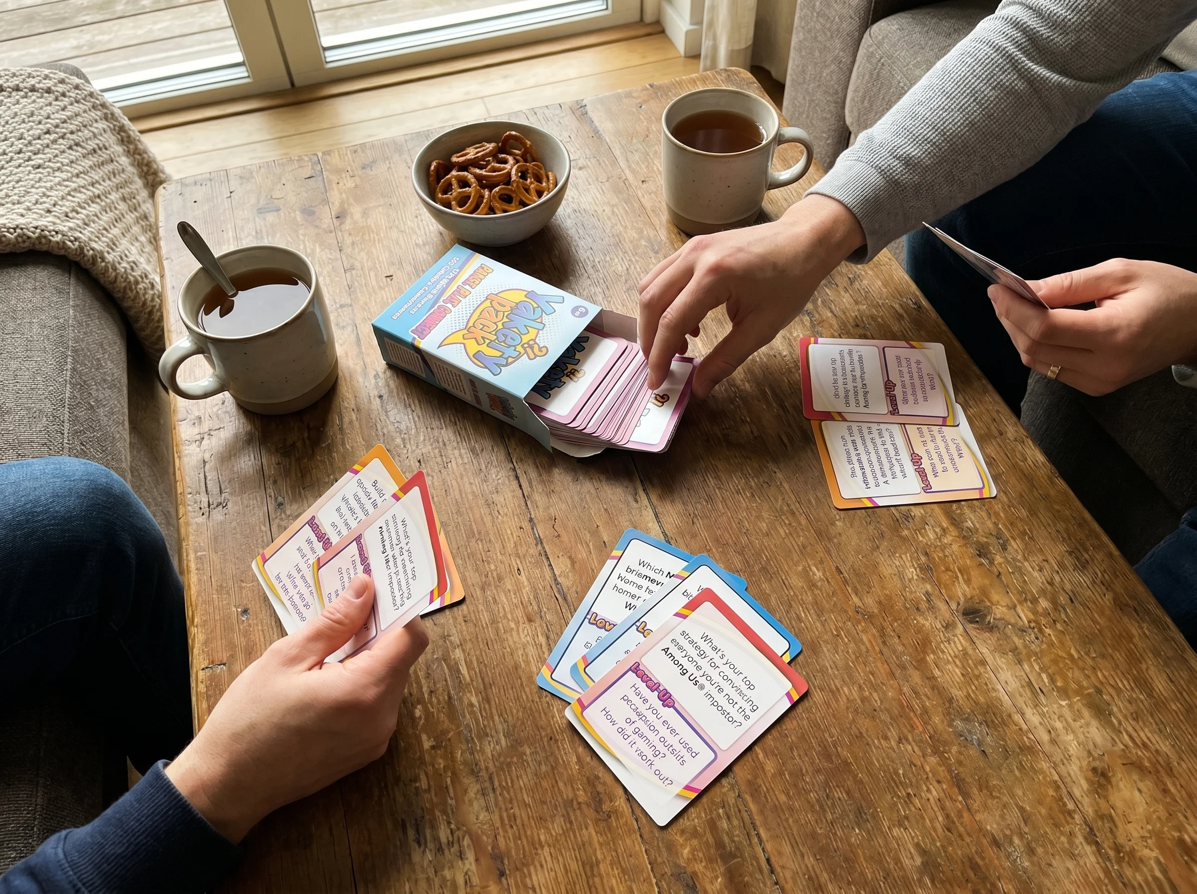 overhead shot of a small two-player strategy game like Patchwork mid-play, wooden pieces and tiles arranged on a coffee table