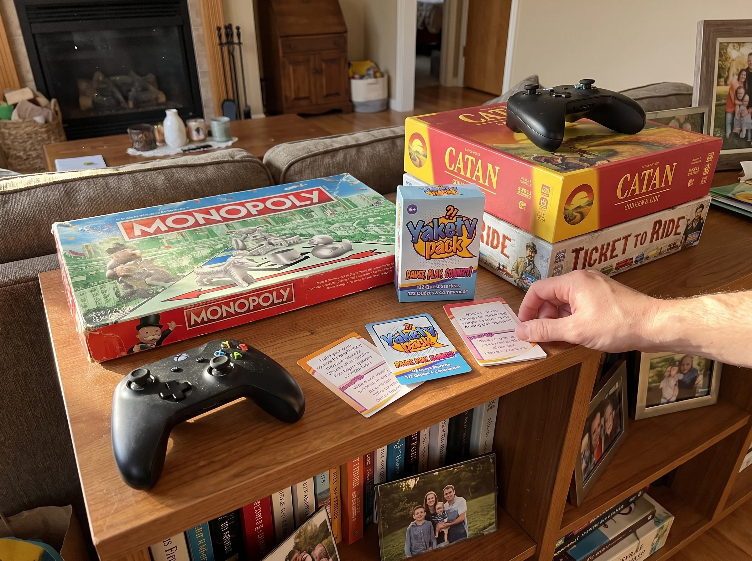 A slightly dusty Monopoly box sitting on a shelf next to newer board games and a game controller, showing the contrast betwee